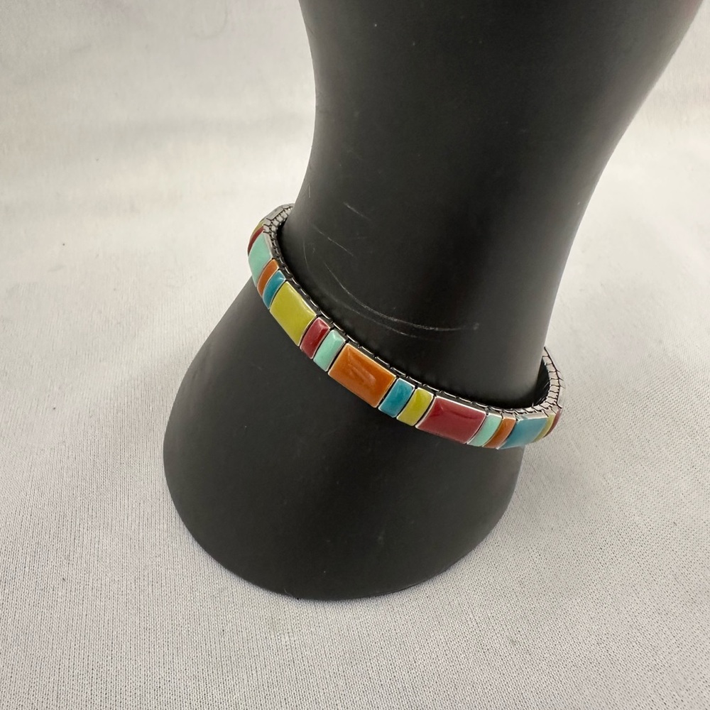 Silver tone expansion bracelet with enameled pieces